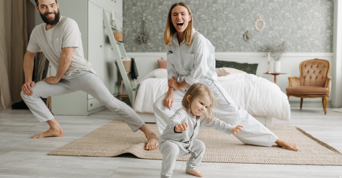 Emirates - Family bonus account with multiple frequent flyers - Woman in White Scrub Suit Sitting on Floor Beside Girl in White Dress Emirates - Family bonus account with multiple frequent flyers - Woman in White Scrub Suit Sitting on Floor Beside Girl in White Dress