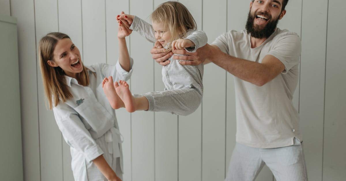 Emirates - Family bonus account with multiple frequent flyers - Man in White Shirt Holding Woman in White Shirt Emirates - Family bonus account with multiple frequent flyers - Man in White Shirt Holding Woman in White Shirt