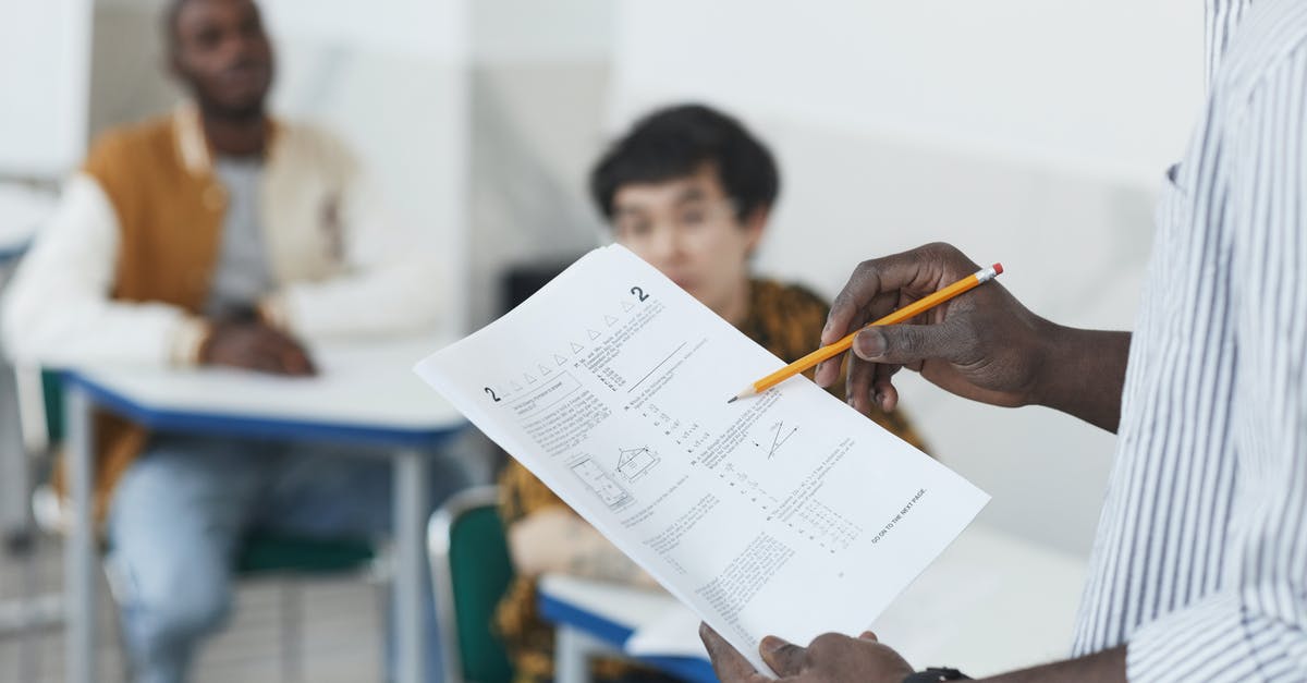 Employment and Education Documents with IM5252e - A Person Holding Test Papers Employment and Education Documents with IM5252e - A Person Holding Test Papers