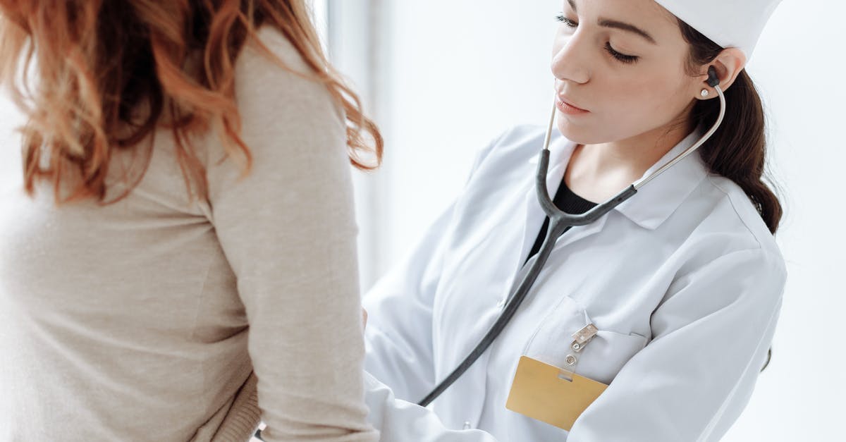English medical records in a Spanish-speaking country? - Photo Of Doctor Checking On Her Patient English medical records in a Spanish-speaking country? - Photo Of Doctor Checking On Her Patient