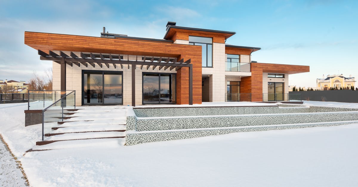 Entering another Schengen Country from India on EU / EAA Residence Permit - Exterior view of contemporary residential house with terrace and large windows located in suburban area in winter day Entering another Schengen Country from India on EU / EAA Residence Permit - Exterior view of contemporary residential house with terrace and large windows located in suburban area in winter day