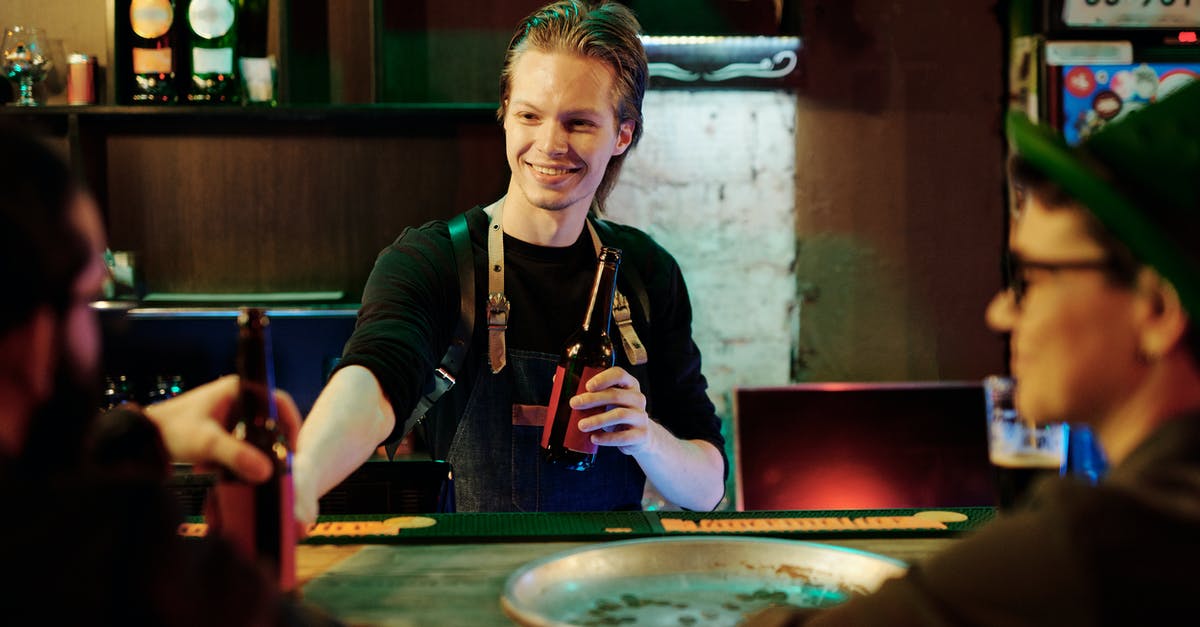 Entering Colombia with Alcohol - Woman in Black Cardigan Sitting on Chair Entering Colombia with Alcohol - Woman in Black Cardigan Sitting on Chair