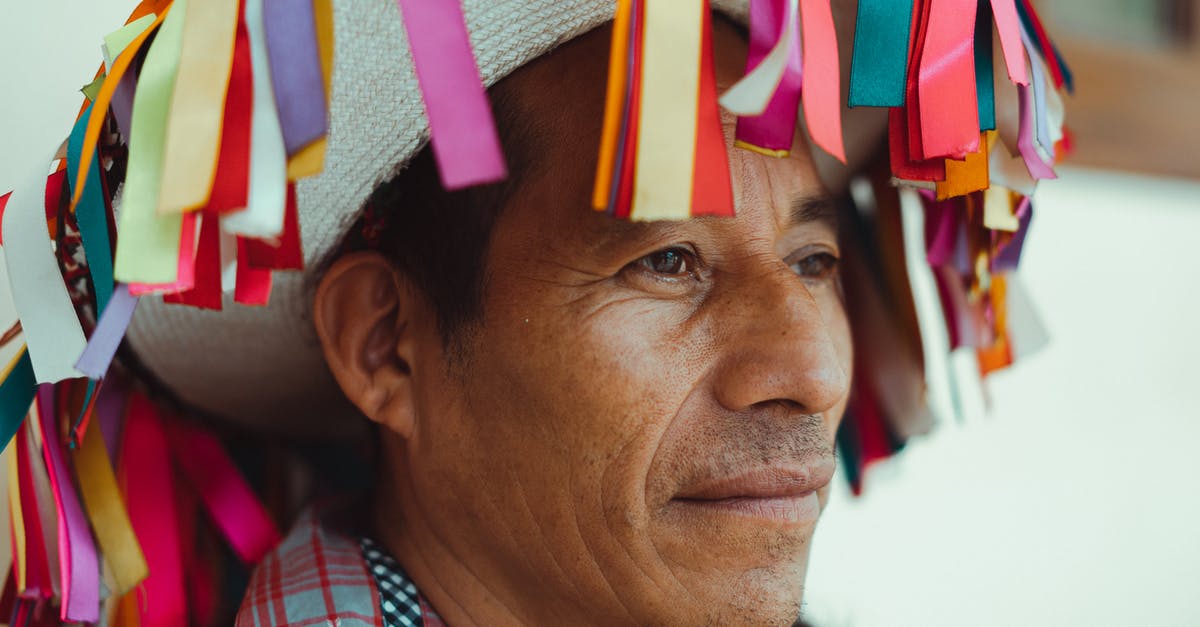 Entering Mexico and re-entering the USA with visitors visa - Close-Up Photo Of Man Wearing Traditional Hat Entering Mexico and re-entering the USA with visitors visa - Close-Up Photo Of Man Wearing Traditional Hat