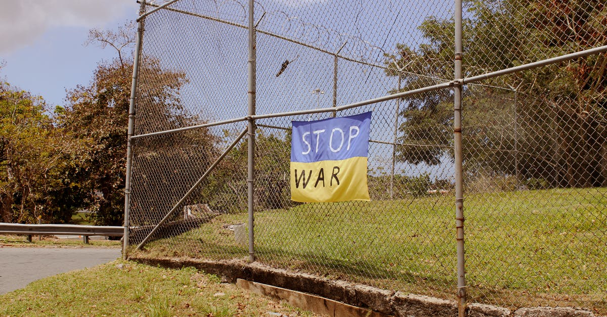 Entering Ukraine as a Ukrainian born, naturalised British citizen - A Banner on a Metal Fence Entering Ukraine as a Ukrainian born, naturalised British citizen - A Banner on a Metal Fence