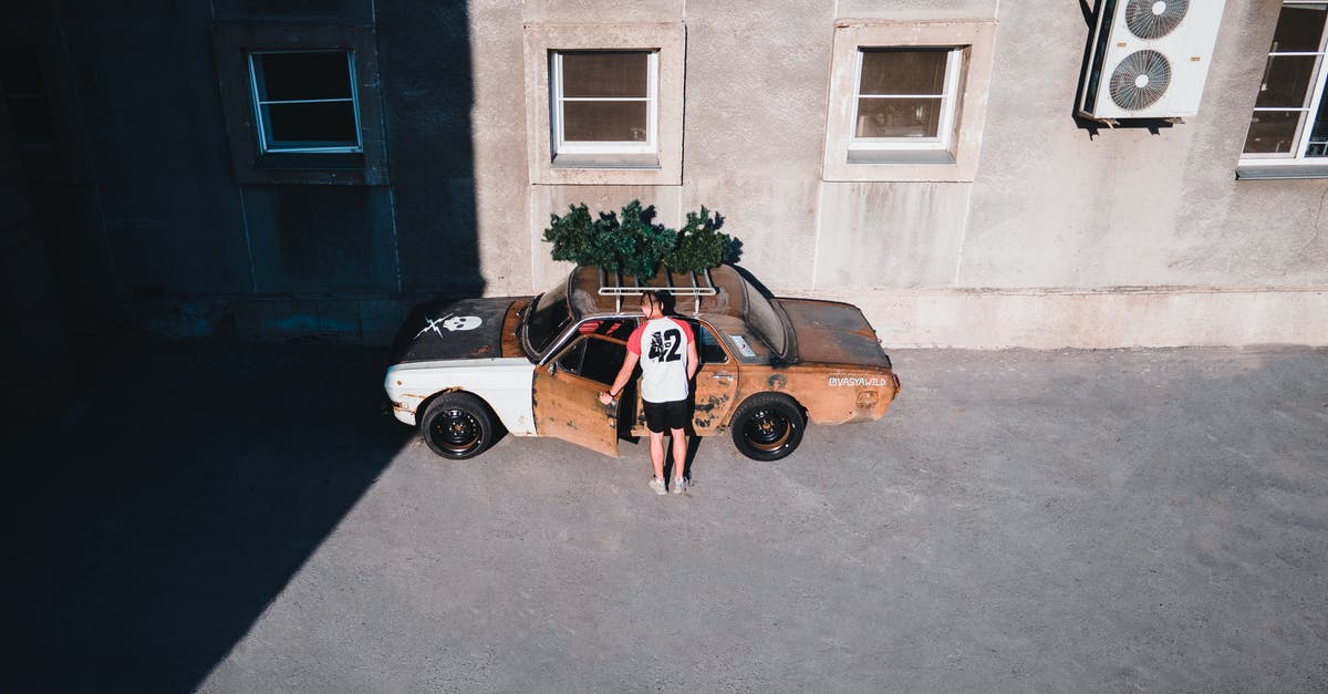 Entering Ukraine with someone else's car - Man Entering a Rusty Car Entering Ukraine with someone else's car - Man Entering a Rusty Car