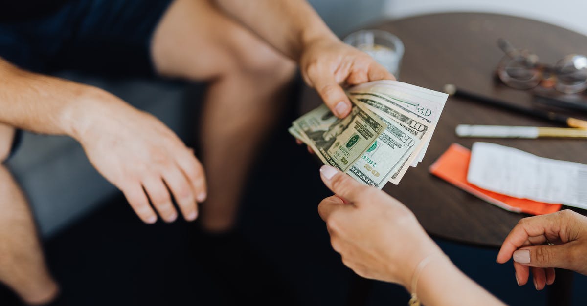 Entrance fee for Zion National Park: Paying for a car vs. paying per person - Person Giving Money to Another Person Entrance fee for Zion National Park: Paying for a car vs. paying per person - Person Giving Money to Another Person