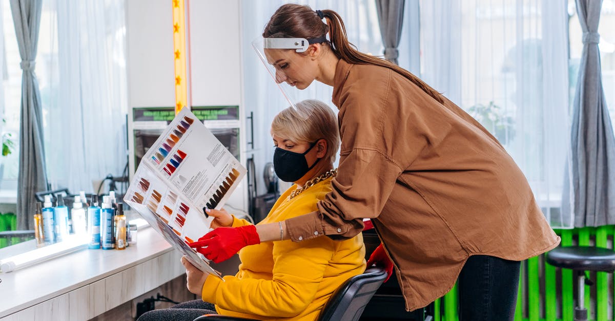 ESTA denied, visit visa still in process - Female hairdresser working with client during pandemic ESTA denied, visit visa still in process - Female hairdresser working with client during pandemic