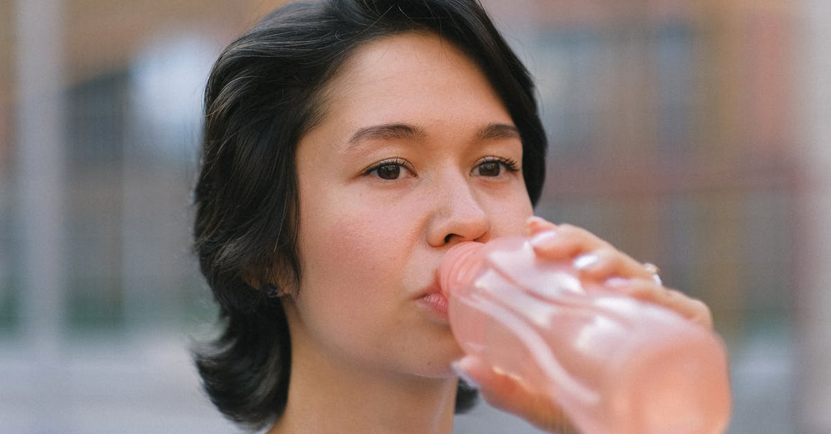 ESTA visiting the US twice for 40 days each with a 20 day break in between - Female drinking water on sports ground