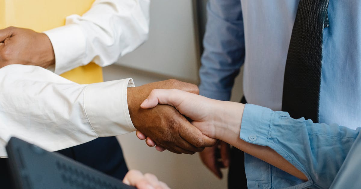 ethnic-related questions by immigration officer - Crop anonymous diverse entrepreneurs shaking hands after meeting and negotiating about new project ethnic-related questions by immigration officer - Crop anonymous diverse entrepreneurs shaking hands after meeting and negotiating about new project