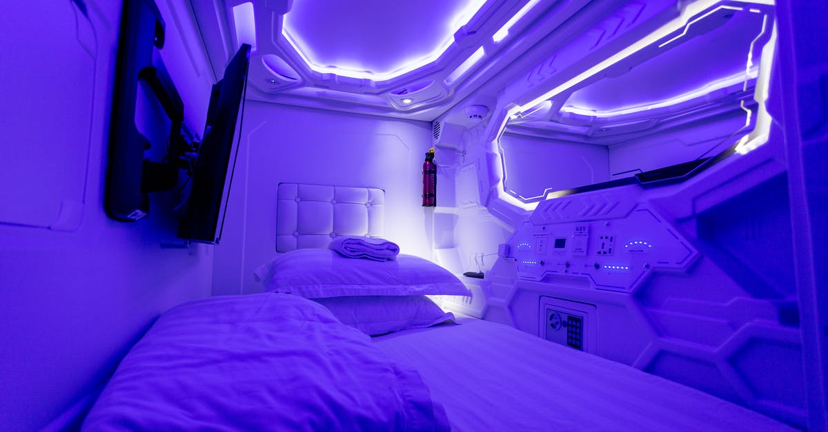 Etiquette in Japanese Ryokan vs. Capsule Hotel - Interior of creative illuminated capsule hotel