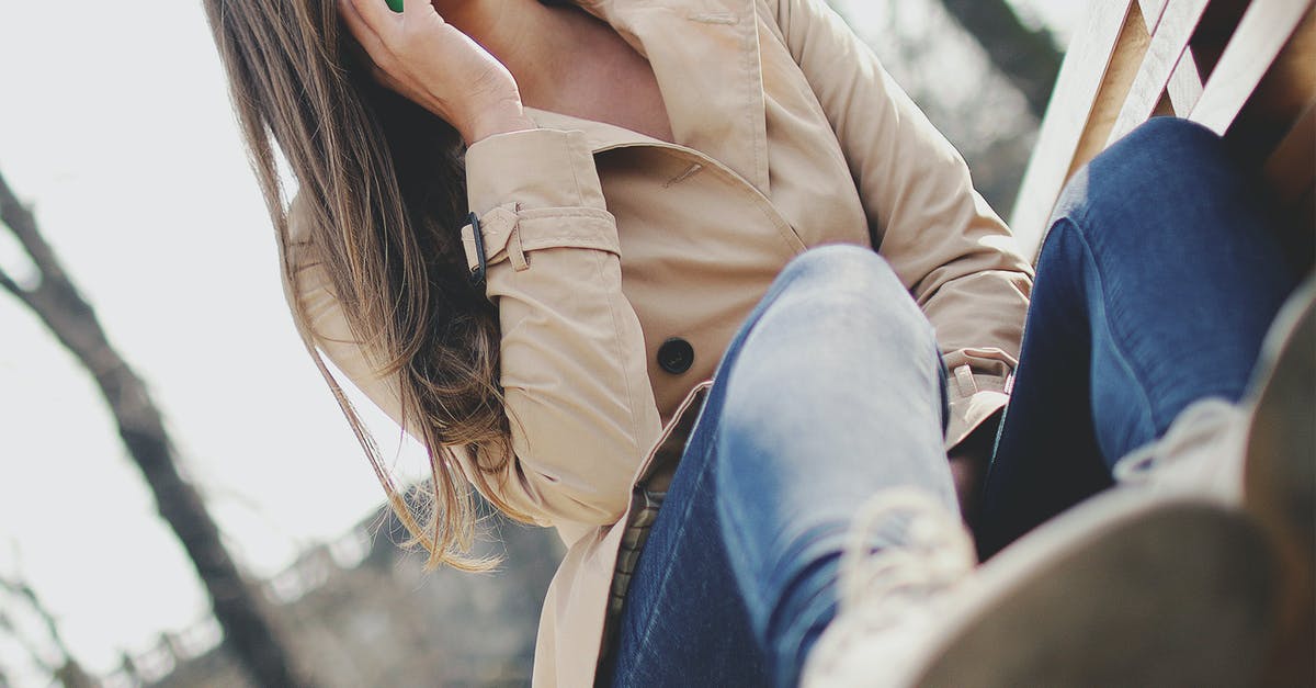 EU roaming when calling a number outside the EU? - Woman Holding Smartphone While Sitting on Bench EU roaming when calling a number outside the EU? - Woman Holding Smartphone While Sitting on Bench