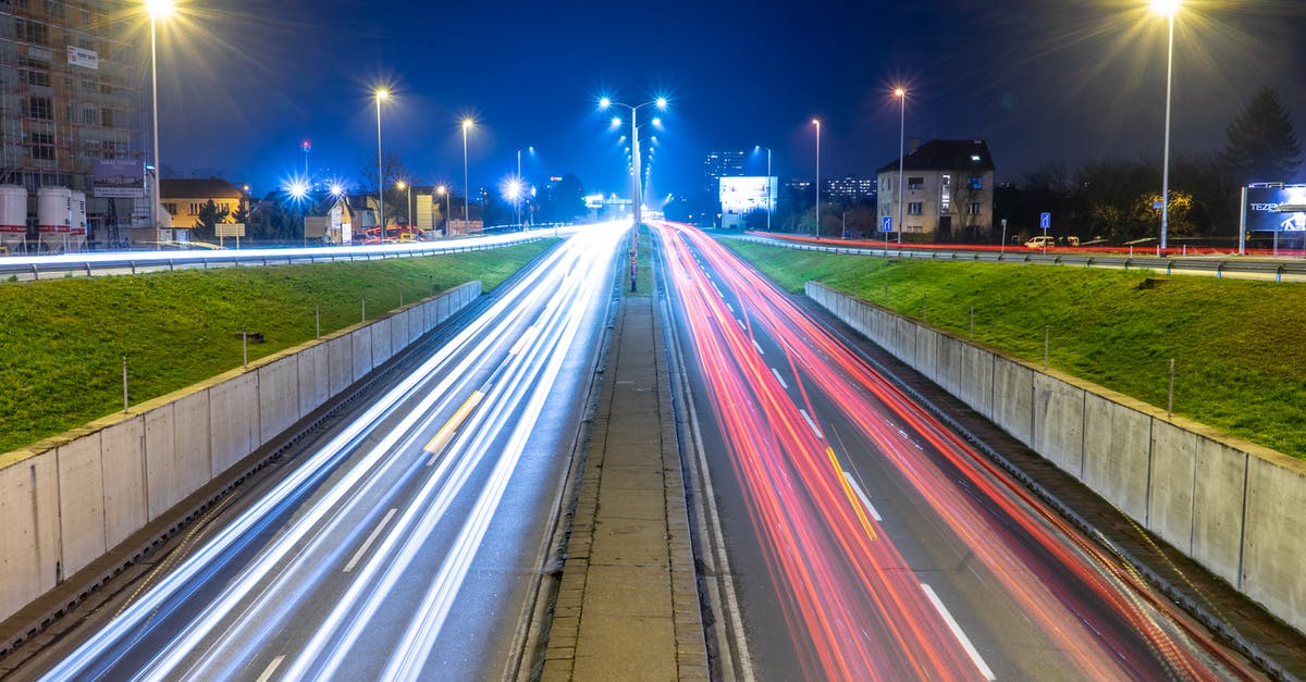 Europe: differences between colours of highway road-signs - Time Lapse Photography of Cars on Road during Night Time Europe: differences between colours of highway road-signs - Time Lapse Photography of Cars on Road during Night Time
