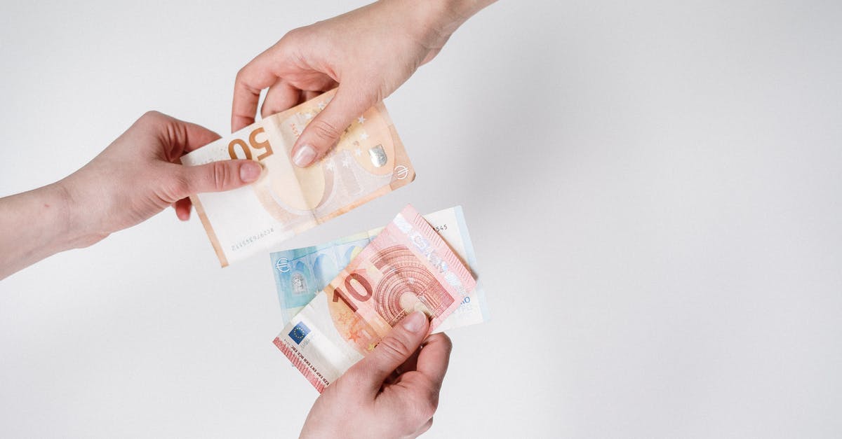 Exchanging Euros (EUR) / Pounds (GBP) to Filipino Pesos (PHP) - Person Holding 10 and 10 Euro Banknotes Exchanging Euros (EUR) / Pounds (GBP) to Filipino Pesos (PHP) - Person Holding 10 and 10 Euro Banknotes