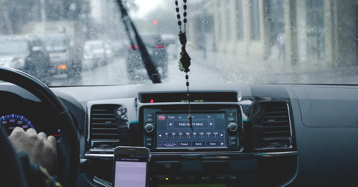 Expedia Travel Insurance in Stereo - Photo of Person Driving Car While Raining Expedia Travel Insurance in Stereo - Photo of Person Driving Car While Raining