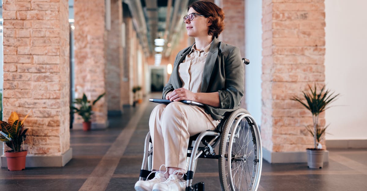 Exploring the Galapagos Islands with a Disabled Individual - Woman in Gray Coat Sitting on Wheelchair Exploring the Galapagos Islands with a Disabled Individual - Woman in Gray Coat Sitting on Wheelchair