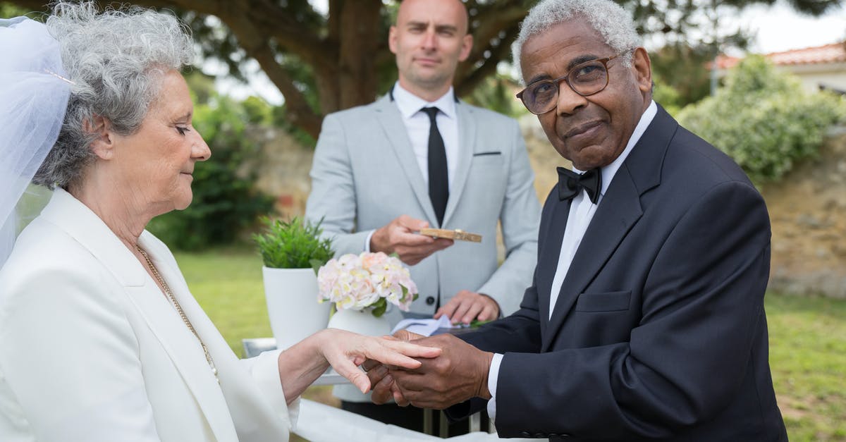 Extending a layover to the next day - Man in Black Suit Holding Bouquet of Flowers Extending a layover to the next day - Man in Black Suit Holding Bouquet of Flowers