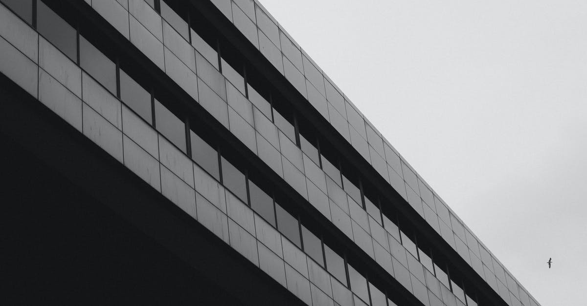 Extending stay in Schengen area as I'm about to get European citizenship [closed] - Modern Office Building Facade