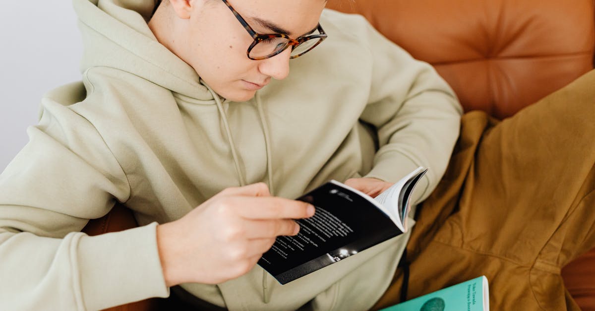 Extension of Schengen visa as a student - Fine Looking Young Man Reading a Book Extension of Schengen visa as a student - Fine Looking Young Man Reading a Book