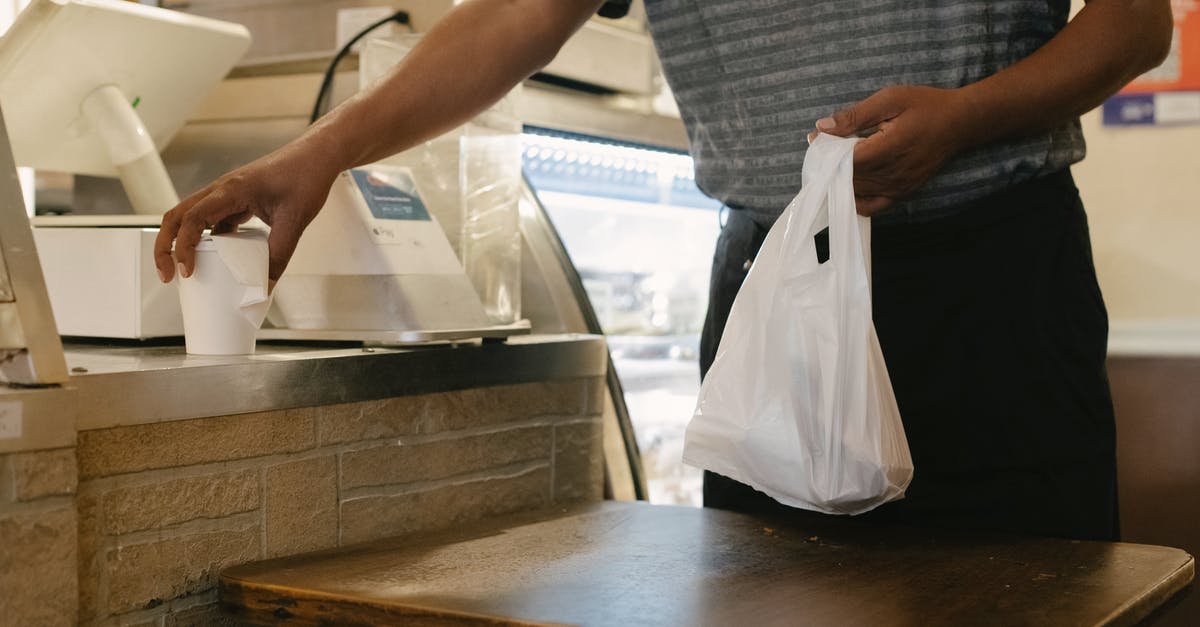 Extra bag with Qatar Airways - Can i pay for an extra bag? [duplicate] - Crop man with purchases in store