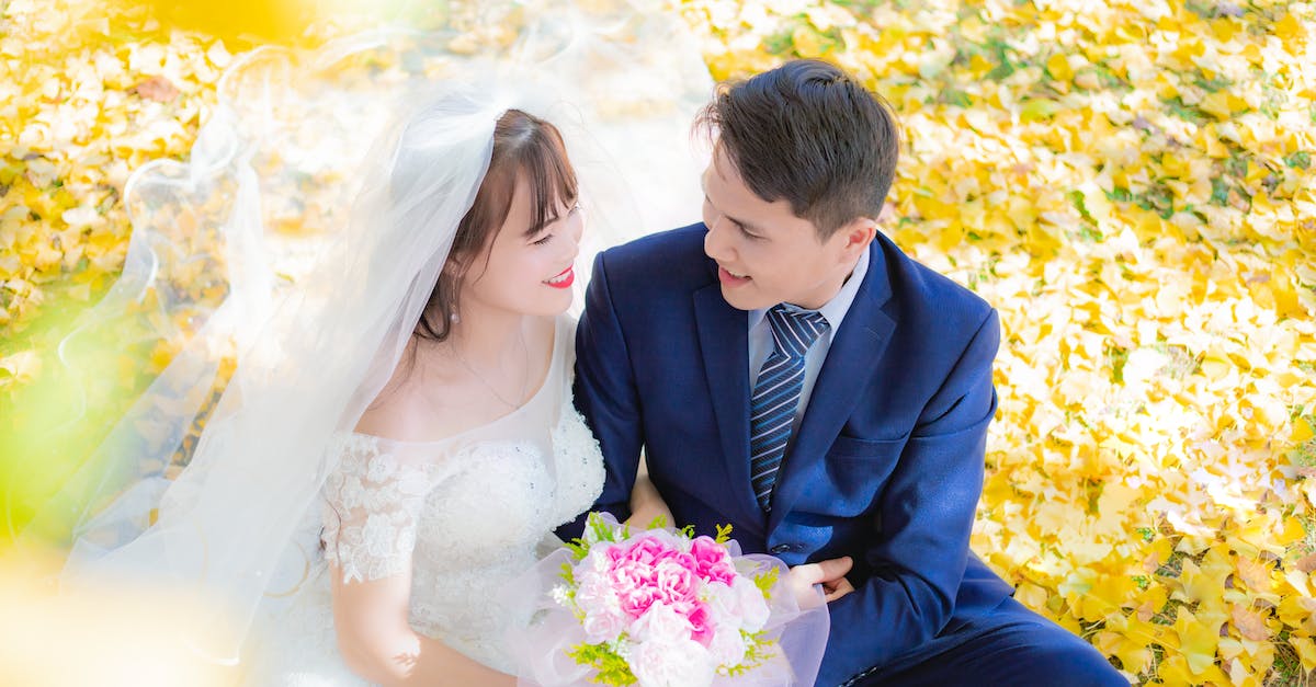 Fall events in Madrid - Married Couple Sitting in a Park at Fall Fall events in Madrid - Married Couple Sitting in a Park at Fall