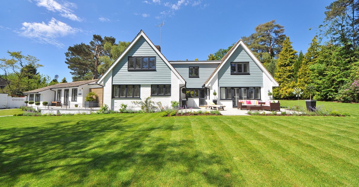 Family visa for UK - White and Gray Wooden House Near Grass Field and Trees Family visa for UK - White and Gray Wooden House Near Grass Field and Trees