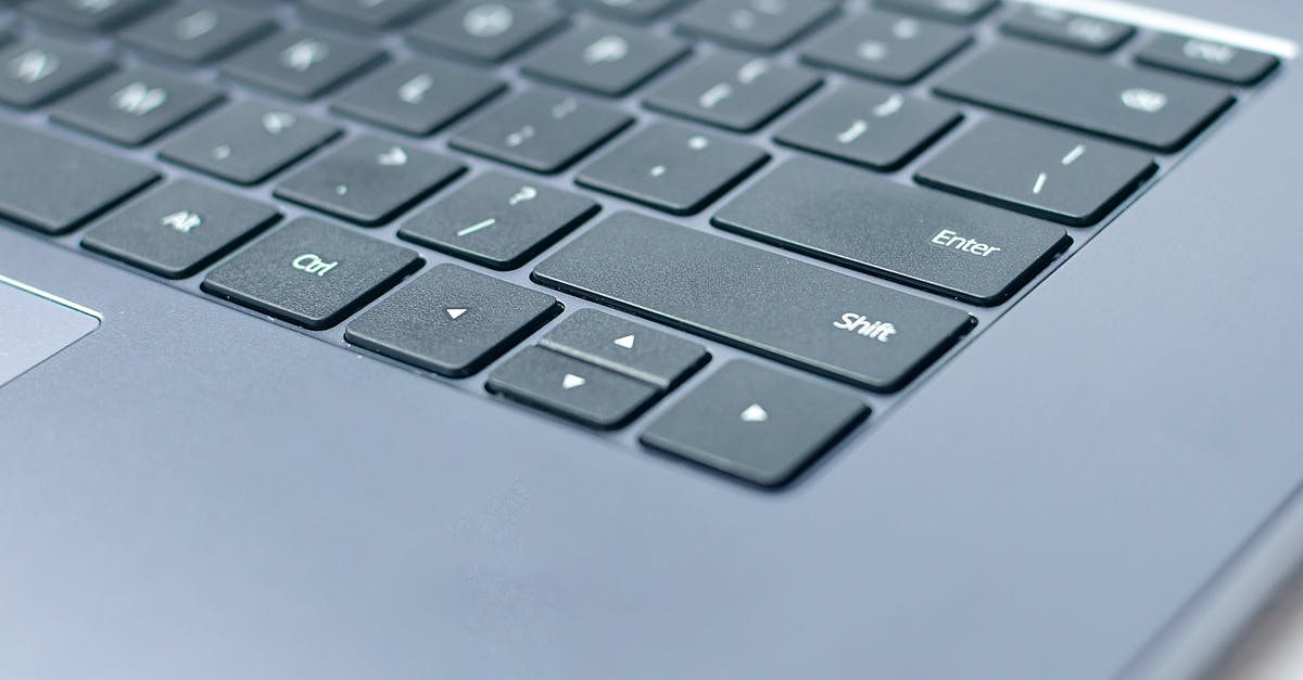Ferry St. Pierre-Canada arriving when CBSA office closed. Can I enter? - From above closeup of contemporary portable computer keyboard with words and symbols on black keys