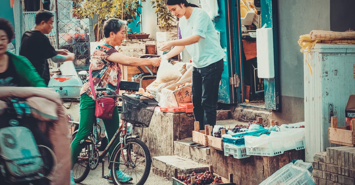 Finding local train ticket agents/offices in China. - Person Riding on Black Bicycle Finding local train ticket agents/offices in China. - Person Riding on Black Bicycle