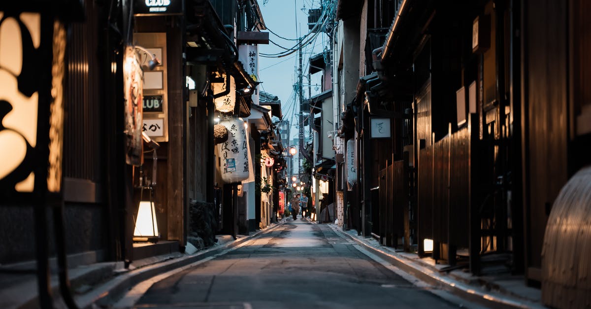 Finding non-smoking restaurants in Japan - People on the Street in Between Buildings Finding non-smoking restaurants in Japan - People on the Street in Between Buildings