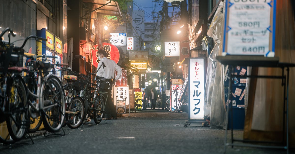 Finding non-smoking restaurants in Japan - Bicycles Parked Beside the Store During Nighttime Finding non-smoking restaurants in Japan - Bicycles Parked Beside the Store During Nighttime