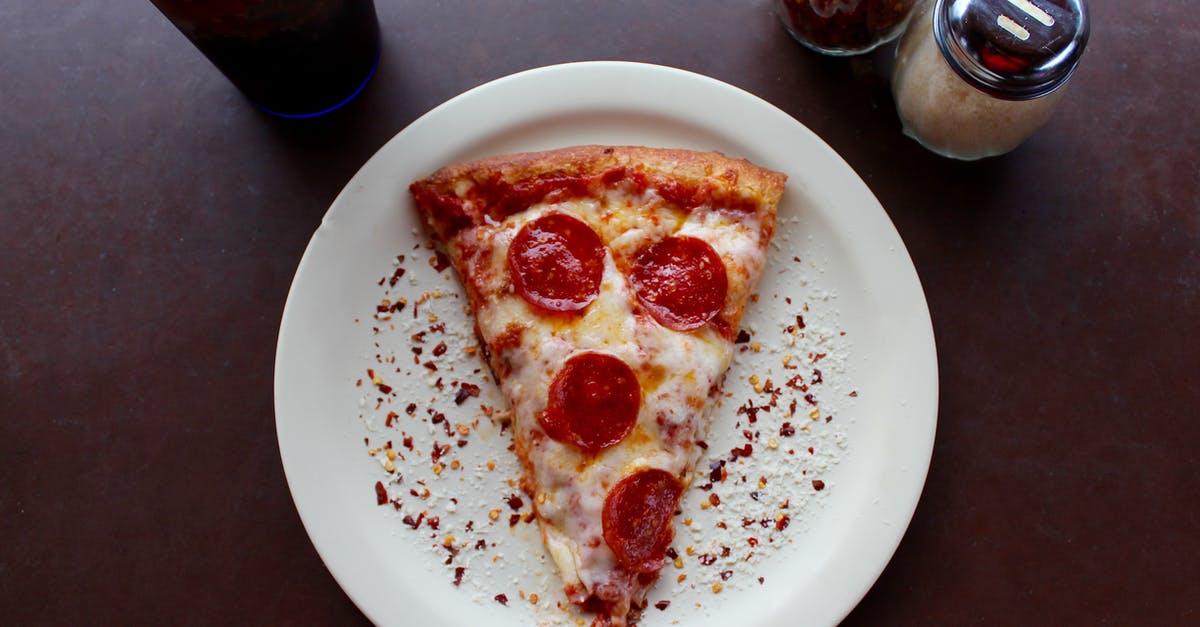 Finding Tella in Ethiopia (on fasting days) - Sliced Pepperoni Pizza on White Ceramic Plate Finding Tella in Ethiopia (on fasting days) - Sliced Pepperoni Pizza on White Ceramic Plate