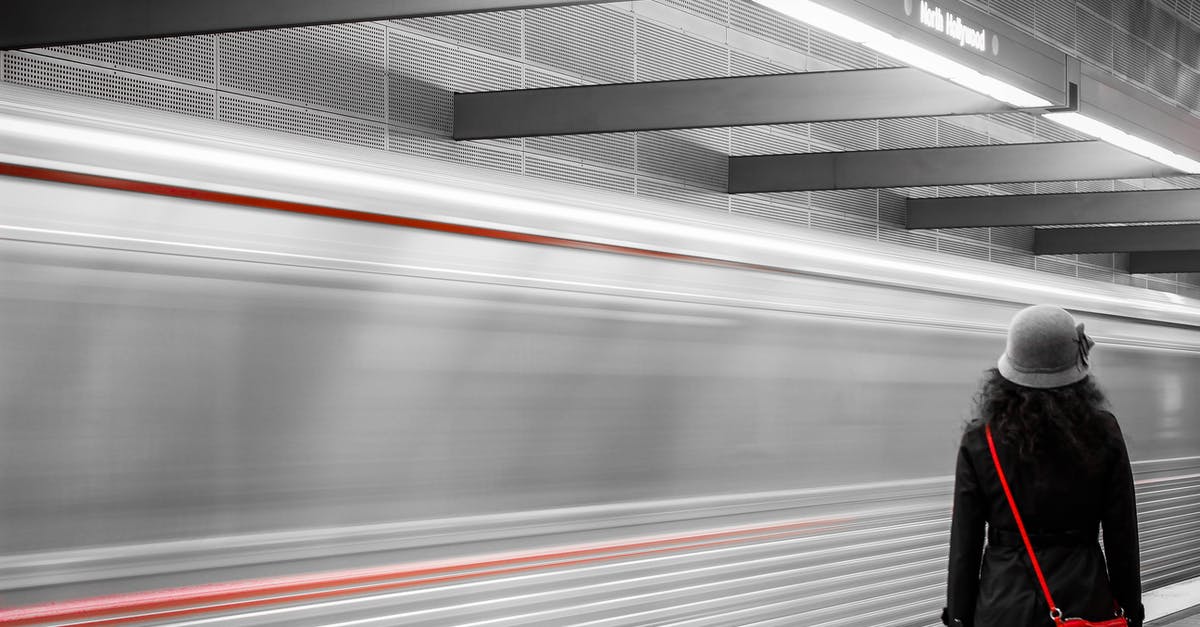 Finding the train station at Copenhagen airport - Woman Wearing Black Coat Finding the train station at Copenhagen airport - Woman Wearing Black Coat