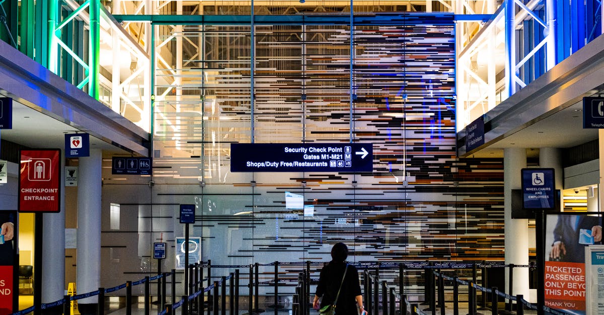 First aid scissors confiscated by Dubai airport security - Person Standing Inside Building