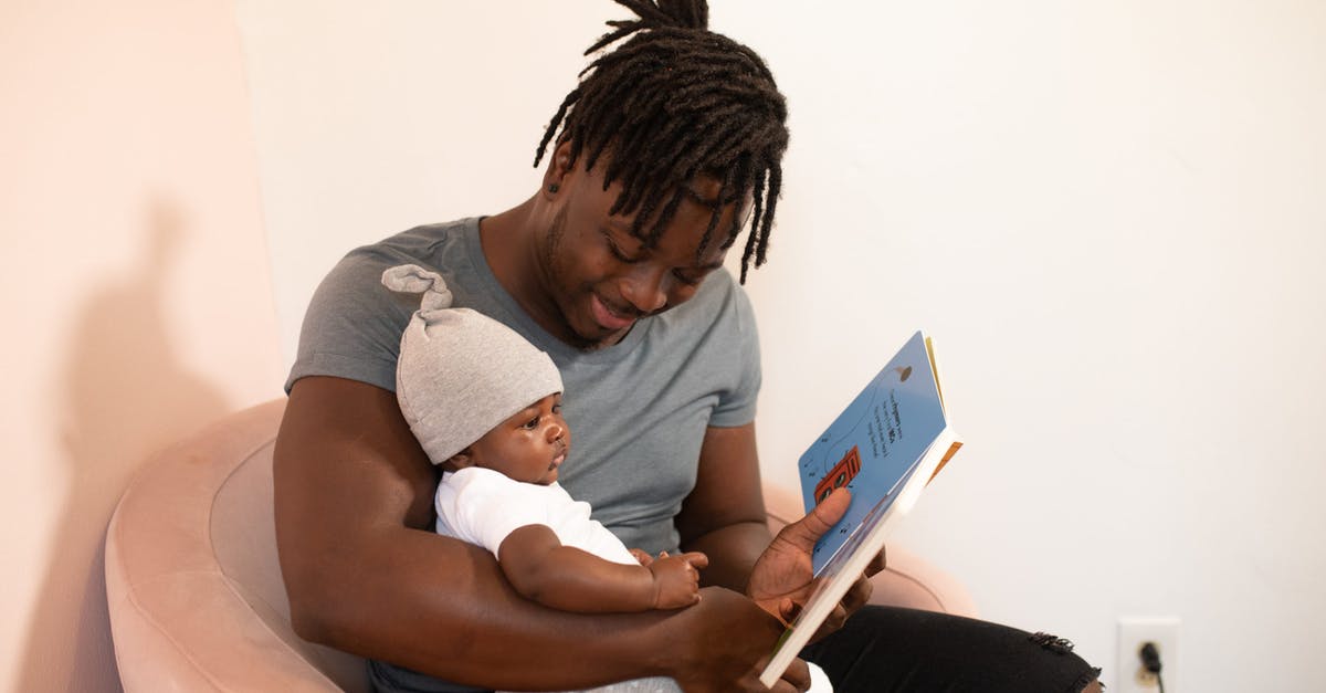 First time traveler: how do I book flights? - Photo Of Man Carrying Baby First time traveler: how do I book flights? - Photo Of Man Carrying Baby