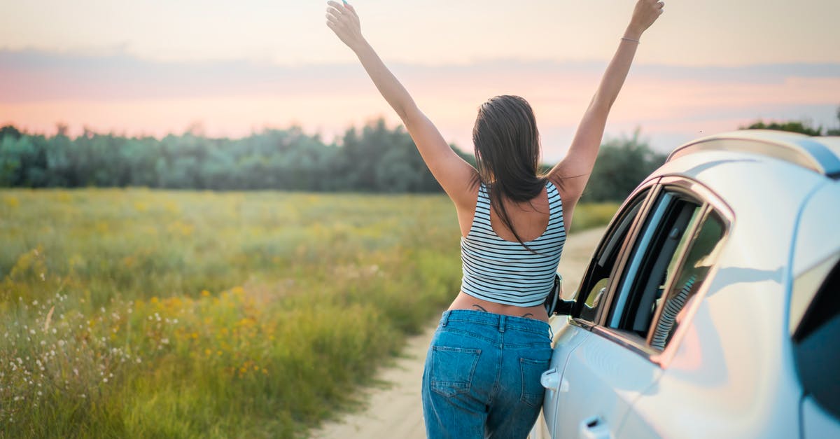 First time traveling alone to Fiji - Woman Leaning Beside Vehicle First time traveling alone to Fiji - Woman Leaning Beside Vehicle