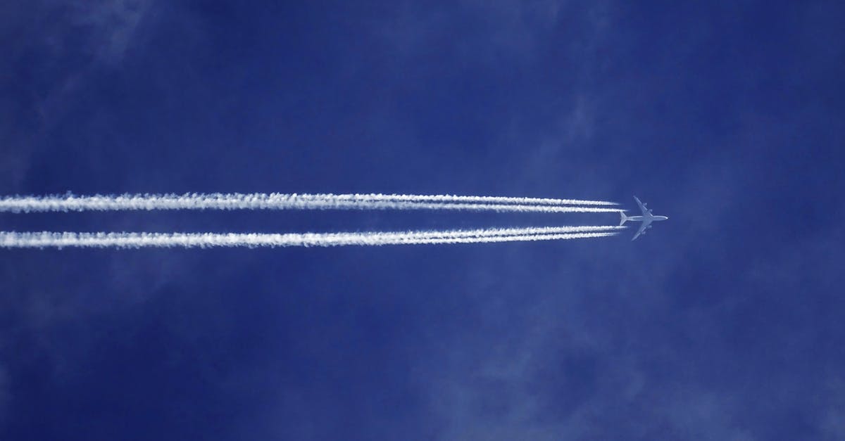 Flight delay compensation due to weather (EU) - Bottom View of Plane With Contrail Flight delay compensation due to weather (EU) - Bottom View of Plane With Contrail