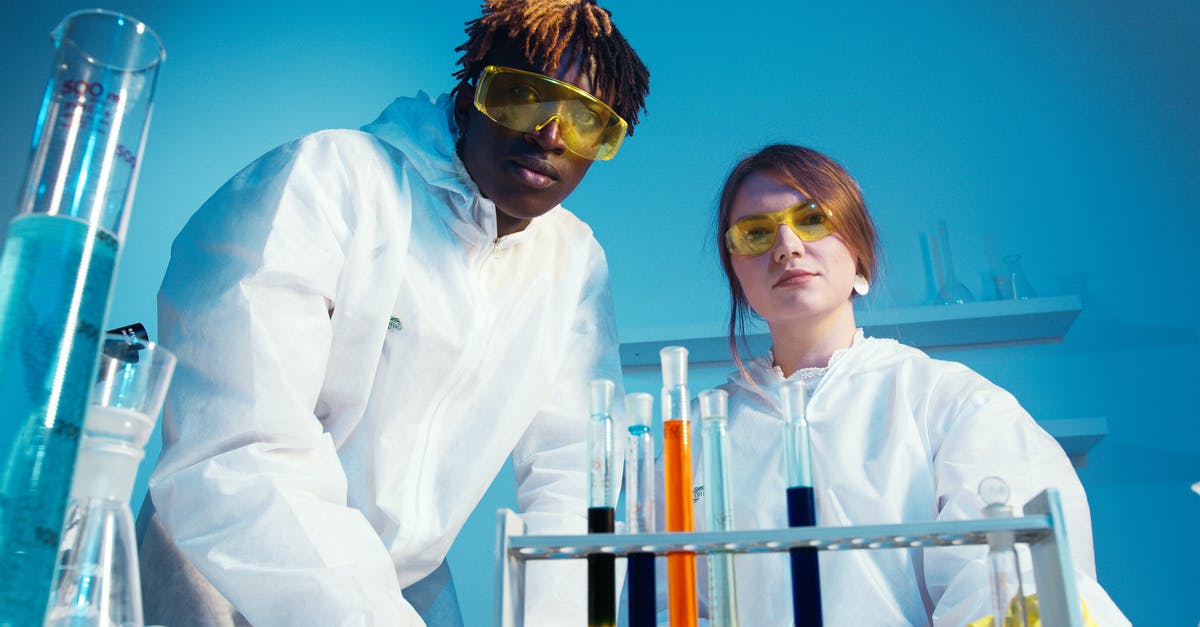 Flight safety and liquid chemicals: 95% alcohol and formol - A Man and a Woman Looking at the Camera Flight safety and liquid chemicals: 95% alcohol and formol - A Man and a Woman Looking at the Camera