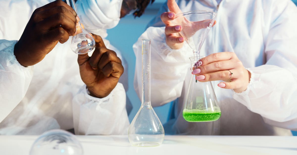 Flight safety and liquid chemicals: 95% alcohol and formol - A Man and a Woman Doing an Experiment Flight safety and liquid chemicals: 95% alcohol and formol - A Man and a Woman Doing an Experiment
