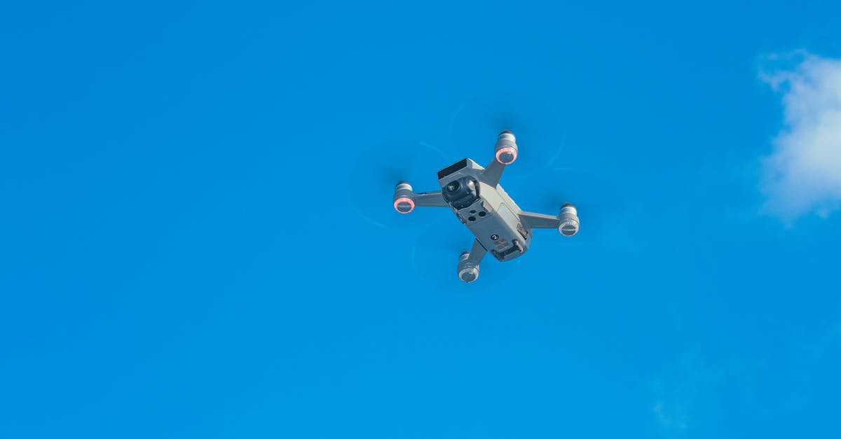 Flight search engine offering results ordered by distance flown - Modern drone against bright sky Flight search engine offering results ordered by distance flown - Modern drone against bright sky