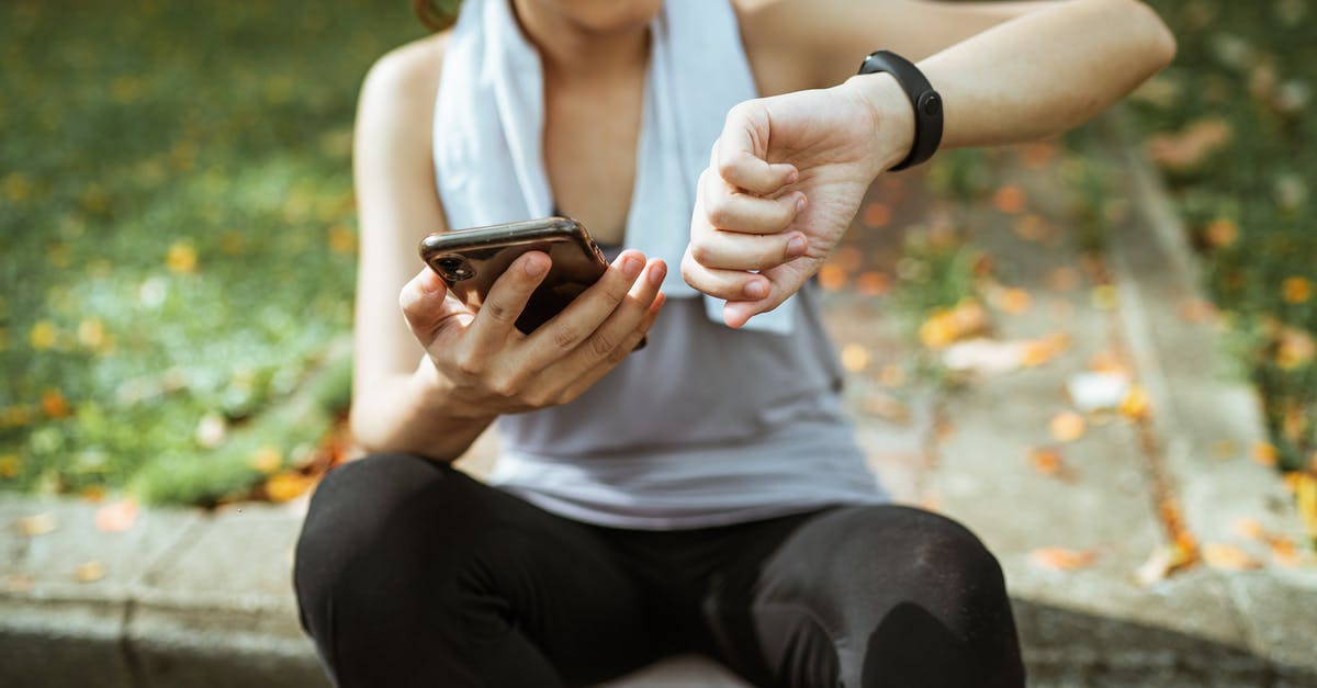 Flying for the first time tomorrow, is a physical boarding pass required or is the app enough? - Anonymous female in sportswear using smartphone and smart watch after exercising on sports ground Flying for the first time tomorrow, is a physical boarding pass required or is the app enough? - Anonymous female in sportswear using smartphone and smart watch after exercising on sports ground