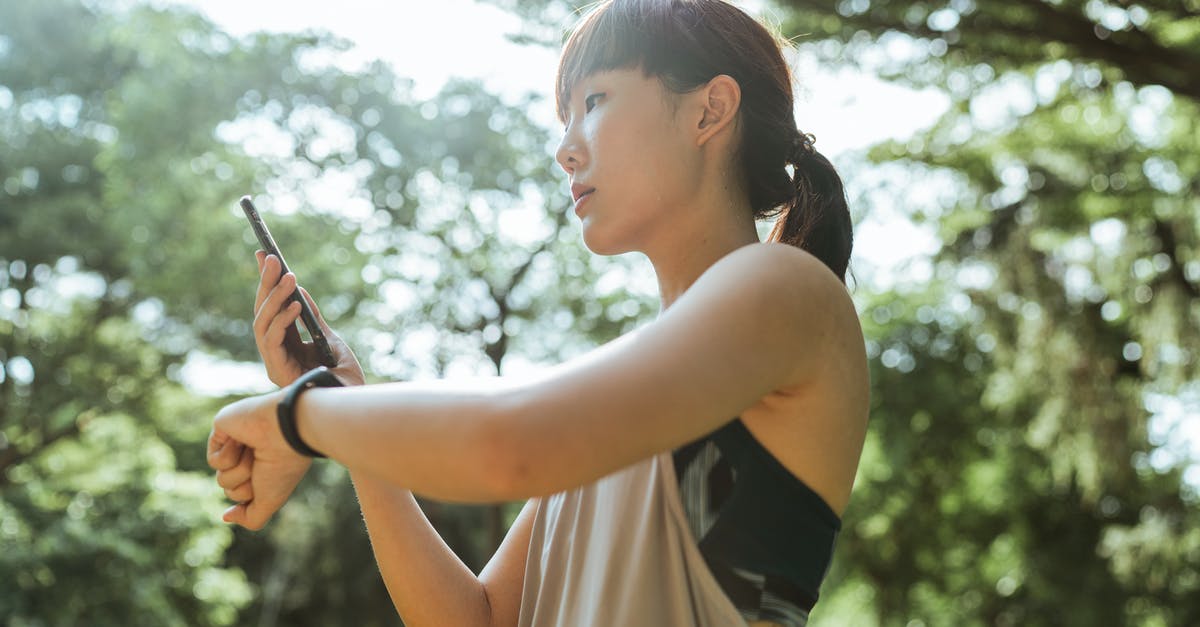 Flying for the first time tomorrow, is a physical boarding pass required or is the app enough? - Young Asian woman using devices for fitness in park Flying for the first time tomorrow, is a physical boarding pass required or is the app enough? - Young Asian woman using devices for fitness in park