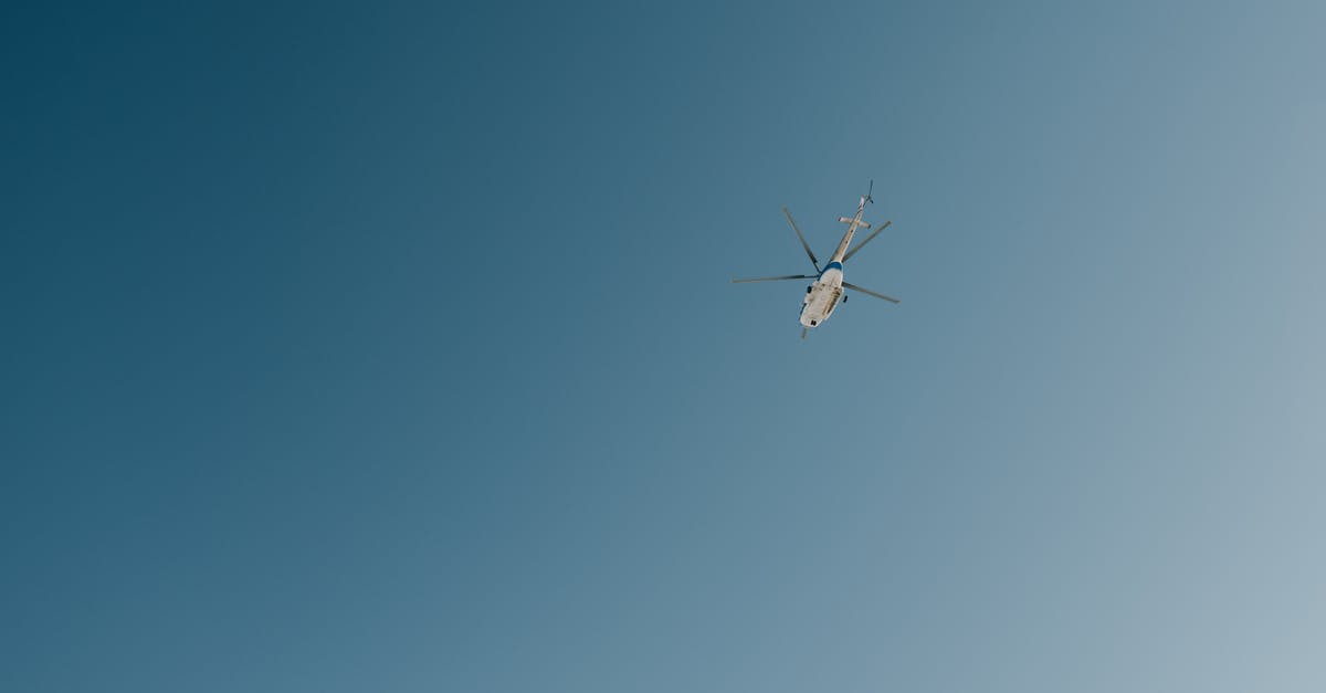 Flying from IAD→YTZ→YHZ—where do I clear Canadian customs? - Helicopter flying in blue cloudless sky Flying from IAD→YTZ→YHZ—where do I clear Canadian customs? - Helicopter flying in blue cloudless sky
