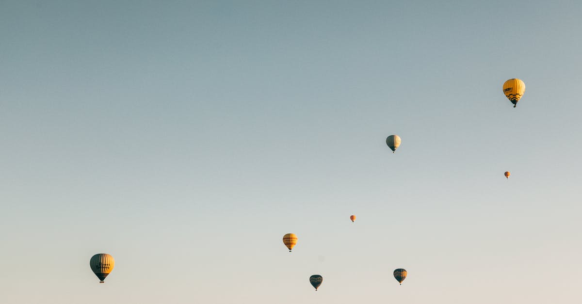 Flying from IAD→YTZ→YHZ—where do I clear Canadian customs? - Colorful air balloons flying in cloudless sky Flying from IAD→YTZ→YHZ—where do I clear Canadian customs? - Colorful air balloons flying in cloudless sky