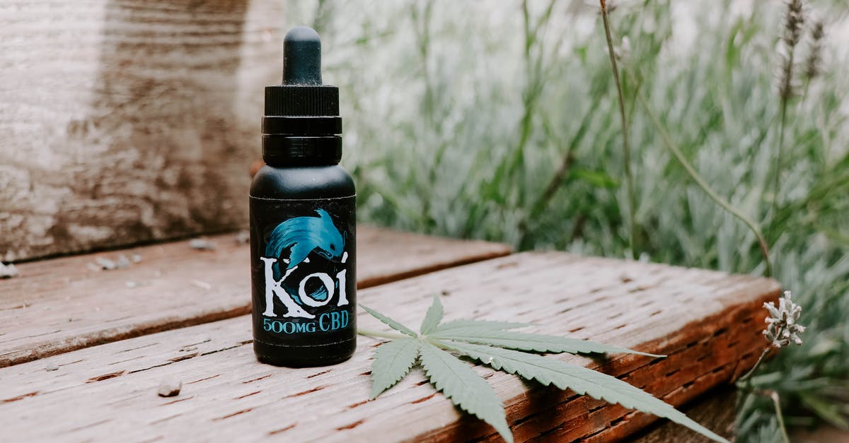Flying with recreational cannabis oil in California? - Black Dropper Bottle on Brown Wooden Slab Flying with recreational cannabis oil in California? - Black Dropper Bottle on Brown Wooden Slab