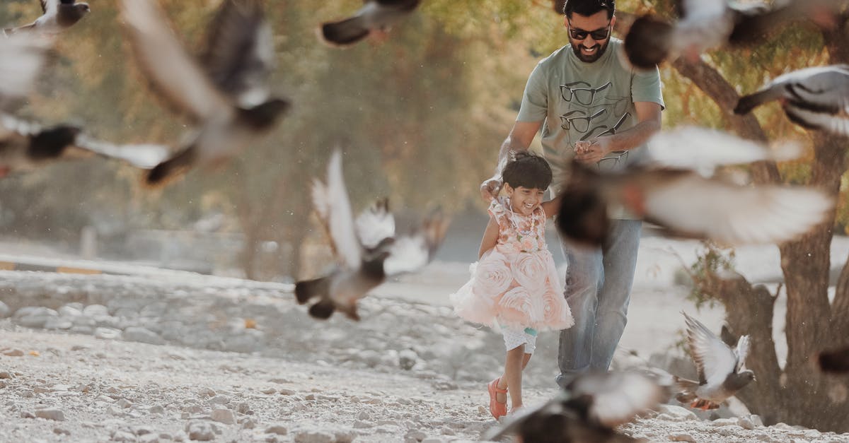 Flying with someone else's children - Man Holding Girl Flying with someone else's children - Man Holding Girl