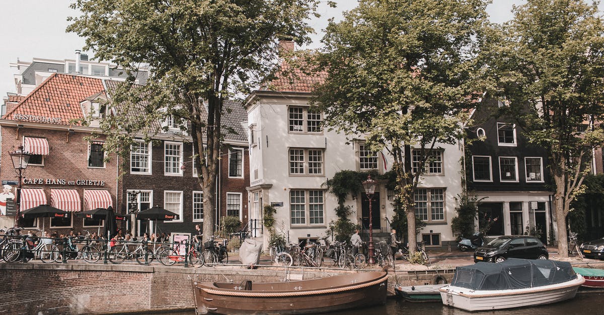 Folding bicycles on Netherlands trains - Brown Boat on Dock Near Green Trees Folding bicycles on Netherlands trains - Brown Boat on Dock Near Green Trees