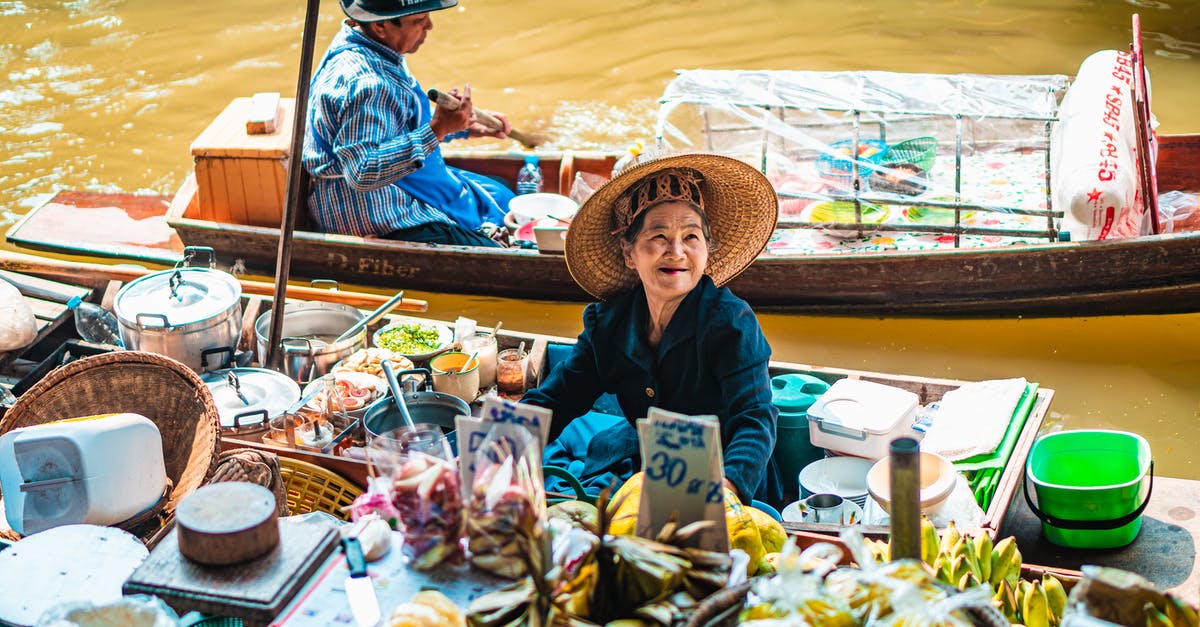 Food options in Bangkok - A Woman Sitting on the Boat Food options in Bangkok - A Woman Sitting on the Boat