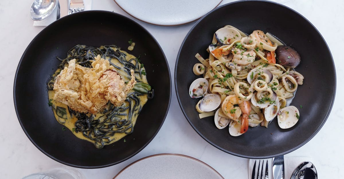 Food prices in Chile - particularly seafood - Seafood Dish on Pans Served on a Table Food prices in Chile - particularly seafood - Seafood Dish on Pans Served on a Table