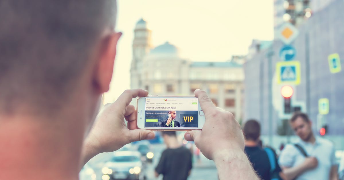 For a person who doesn't work but got the necessary money. How the bank statement should be when applying for uk tourist visa? [duplicate] - Man Standing Near Outdoor While Holding White Smartphone