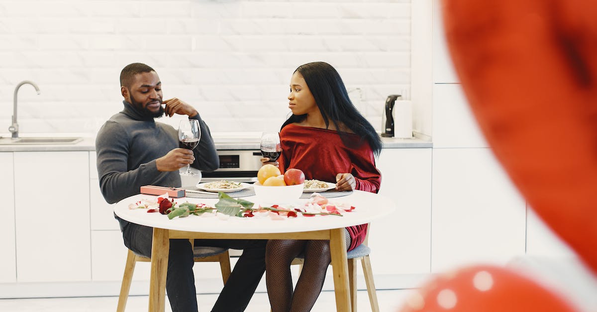For fear of flying is drinking alcohol a healthier option than pills? - Man and Woman by Table in Kitchen For fear of flying is drinking alcohol a healthier option than pills? - Man and Woman by Table in Kitchen