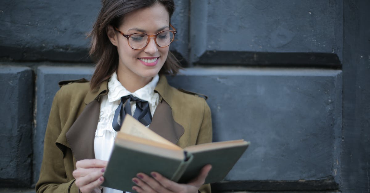 Forgot old passport with schengen/student visa - Happy adult woman reading book with interest on street Forgot old passport with schengen/student visa - Happy adult woman reading book with interest on street